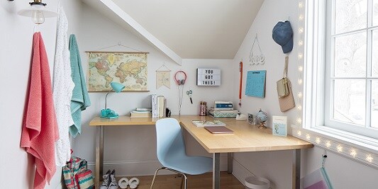 Study area with items held by Command hooks and strips
