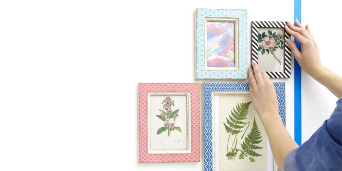 Hanging picture frames on wall
