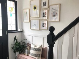 Picture frames hanging near front door