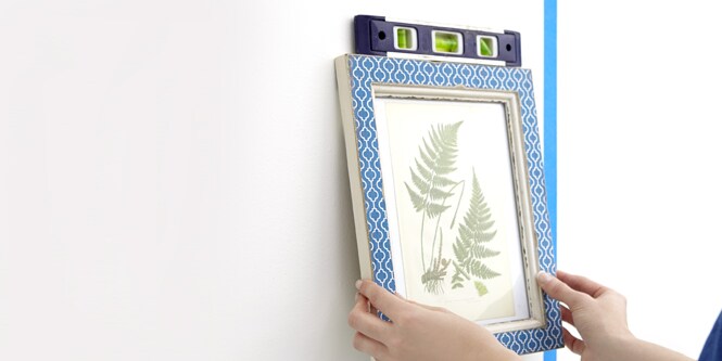Hanging a picture frame on wall
