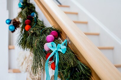 Christmas decorations hanging on banister