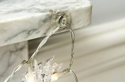 Command™ clear hook hanging a christmas decoration