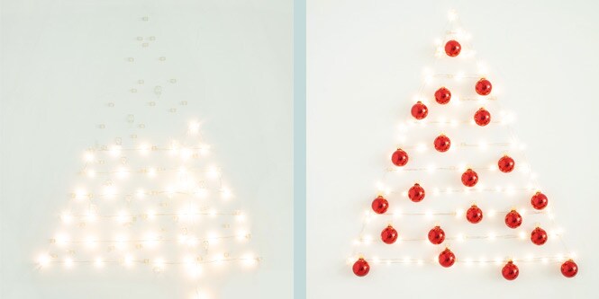 Command™ clear hooks hanging Christmas lights and baubles on wall
